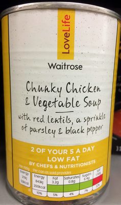 Chunky chicken and vegetable soup with red lentils, a sprinkle of parsley & black pepper
